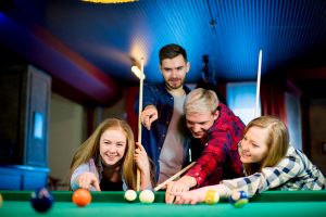 Young people playing pool